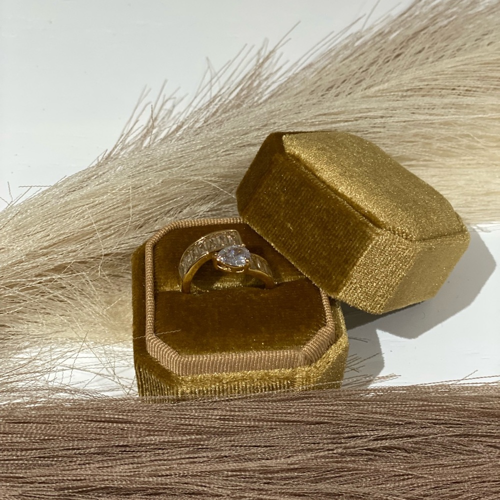 Luxurious Gold and White Ring with Central Stone